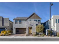 Contemporary two-story home with stone accents and a two-car garage at 3206 Fountaintree Ave, Henderson, NV 89044