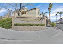 Community entrance sign for Sunhampton Private Residences under a blue sky at 3672 Angela Robin St # 206, Las Vegas, NV 89129