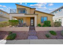 Beautiful single-Gathering home with a covered porch, balcony, and professionally landscaped front yard in a suburban community at 1091 E Sunset Rd, Henderson, NV 89011