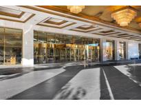 Luxury building entrance featuring a gold-accented revolving door and elegant lighting at 2000 N Fashion Show Dr # 5326, Las Vegas, NV 89109