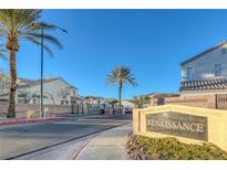 A well maintained Renaissance community entrance with lush desert landscaping and palm trees at 4833 Integrity St, North Las Vegas, NV 89031