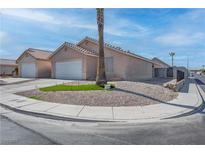 Charming single-story home with low maintenance desert landscaping and a two-car garage at 5541 Ramirez St, North Las Vegas, NV 89031