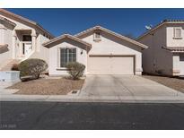 Charming single story home with desert landscaping, a two-car garage, and a clean, welcoming facade at 1056 Sweeping Ivy Ct, Las Vegas, NV 89183