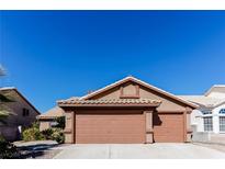 Charming single-story home with a three car garage and desert landscaping at 144 La Mirada Dr, Henderson, NV 89015