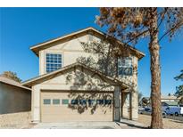 Charming two-story home with a two-car garage and well-maintained exterior at 557 Liverpool Ave, Henderson, NV 89011