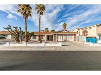 Charming single-story home featuring desert landscaping, palm trees, and a spacious driveway at 6202 La Palma Pkwy, Las Vegas, NV 89118