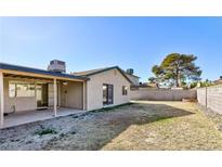 Spacious backyard with a covered patio area, perfect for outdoor entertaining and relaxation at 7176 Southpark Ct, Las Vegas, NV 89147