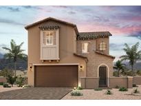 Two-story home showcasing a blend of stucco and stone with a desert landscape at 8958 Faxom St, Las Vegas, NV 89166