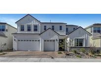 Stunning two-story home showcasing a three-car garage and manicured landscaping at 9007 Antora Summit St, Las Vegas, NV 89166