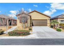 Inviting single-story home featuring a two-car garage and low maintenance landscaping at 4340 Hatch Bend Ave, North Las Vegas, NV 89031