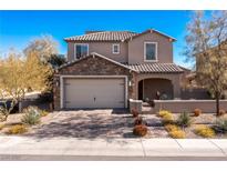 Charming two-story home featuring a stone facade, two-car garage and well maintained desert landscaping at 436 Trevinca St, Las Vegas, NV 89138