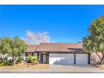 Charming single-story home with a well-maintained front yard and a spacious two-car garage at 1942 Hallwood Dr, Las Vegas, NV 89119