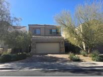 Charming two-story home featuring a two-car garage and low maintenance front yard at 373 Wilford Springs St, Henderson, NV 89014