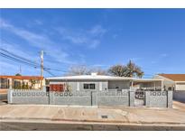Charming single story home with a concrete fence and well-maintained front yard at 513 Elm St, Boulder City, NV 89005