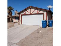 Cozy single-story home with a two-car garage, concrete driveway, and desert landscaping at 6760 Fallona Ave, Las Vegas, NV 89156