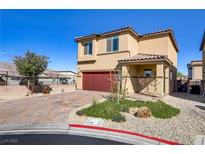 Charming home featuring a two-car garage, neutral stucco exterior, and drought-tolerant landscaping at 7370 Glowing Point St, North Las Vegas, NV 89084