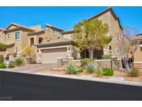 Charming two-story stucco home featuring a paved driveway and an attached two-car garage at 8 Via Dolcetto, Henderson, NV 89011