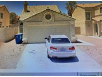 Exterior view of home with two car garage and front driveway parking at 201 Fig Ct, Las Vegas, NV 89145