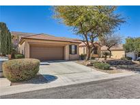 Charming single-story home featuring a well-manicured front yard and attached two car garage at 2783 Cherrydale Falls Dr, Henderson, NV 89052