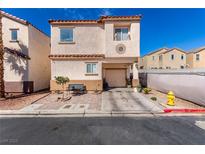 Charming two-story home with desert landscaping, a front bench, and a one-car garage, all under a clear blue sky at 4786 Valleyside Ave, Las Vegas, NV 89115