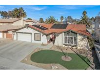 Charming single story home with a well manicured front yard, solar panels, and a two car garage at 5200 Valley Glen St, Las Vegas, NV 89119