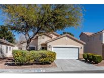 Charming single-story home featuring a well-maintained yard and an attached two-car garage at 6314 Ruby Cedar Ct, North Las Vegas, NV 89031