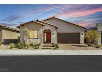 Charming single-story home showcasing a landscaped front yard and inviting entry with a red door at 144 Sarabeth St, Las Vegas, NV 89138