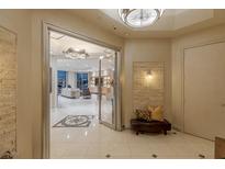 Elegant entryway features marble floors, decorative rug and an open living space with lots of natural light at 2747 Paradise Rd # Ph 3604, Las Vegas, NV 89109