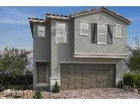 Two-story home featuring a two-car garage and neutral-colored stucco exterior at 6604 Tumoulin St, Las Vegas, NV 89148