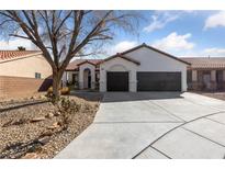 Charming single-story home with a tile roof, stucco exterior, and a spacious two-car garage at 7505 Crystal Clear Ave, Las Vegas, NV 89113