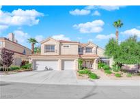 Charming two-story home with a three-car garage, mature landscaping, and a welcoming entrance at 7632 Desert Largo Ave, Las Vegas, NV 89128