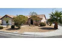 Charming single-story home featuring desert landscaping and a tile roof at , Las Vegas, NV 89118