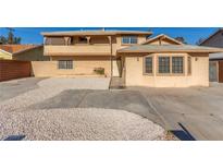 Inviting two-story home with unique architectural details and concrete driveway at 2232 Valley Dr, Las Vegas, NV 89108