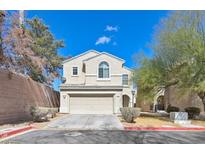 Charming two-story home featuring a well-maintained yard and a two-car garage at 232 Charitable Ct, North Las Vegas, NV 89032