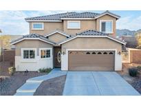 Charming two-story home features a well-maintained yard and an attached two-car garage at 2681 Benton Cove St, Laughlin, NV 89029