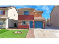 Charming two-story home with blue door and a well-maintained front yard at 5288 Emelita St, Las Vegas, NV 89122