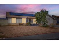 Cozy single-story home featuring desert landscaping and solar panels for energy efficiency at 53 Montello Ave, Las Vegas, NV 89110