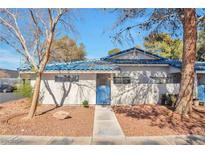 Charming single-story home featuring a blue tiled roof and a well-maintained front yard at 2110 Bavington Dr # C, Las Vegas, NV 89108
