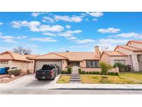 Charming single-story home featuring a well-maintained front yard, neutral paint, and a convenient attached garage at 3901 W Red Coach Ave, North Las Vegas, NV 89031