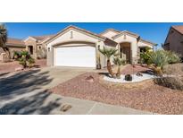 Charming single-story home featuring desert landscaping and a two-car garage in a sunny locale at 486 Dart Brook Pl, Henderson, NV 89012