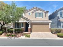 Charming two-story home with a well-maintained front yard, covered porch, and an attached two-car garage at 6240 Winston Falls Ave, Las Vegas, NV 89139