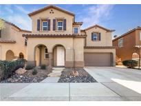Charming two-story home with desert landscaping and a two-car garage at 7211 Hickory Post Ave, Las Vegas, NV 89179