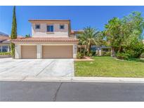 Charming two-story home with a well-manicured lawn, lush trees, and a spacious two-car garage at 7808 Foothill Ash Ave, Las Vegas, NV 89117