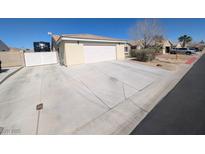 Single Gathering home featuring a two car garage and long concrete driveway at 8018 Rushmore Ave, Las Vegas, NV 89131