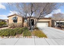 Charming single-story home with a well-manicured front yard and attached two-car garage at 9436 Teton Ridge Ave, Las Vegas, NV 89149