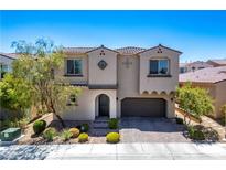 Charming two-story home featuring a well-manicured front yard and a two-car garage at 9643 Ponderosa Skye Ct, Las Vegas, NV 89166