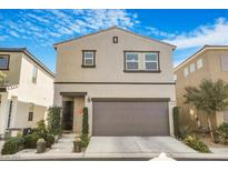 Charming two-story home featuring a well-manicured front yard and a two-car garage at 3681 Via Sonja Ave, Las Vegas, NV 89115