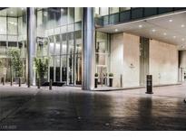 Elegant building entrance with modern architectural design and manicured landscaping at Waldorf Astoria Residences at 3750 Las Vegas Blvd # 2408, Las Vegas, NV 89158