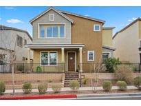 Charming two-story home featuring a well-maintained front yard and inviting entryway at 408 Gracious Way, Henderson, NV 89011