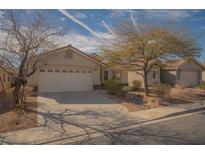 Inviting single-story home with desert landscaping and an attached two-car garage at 5989 Sierra Medina Ave, Las Vegas, NV 89139